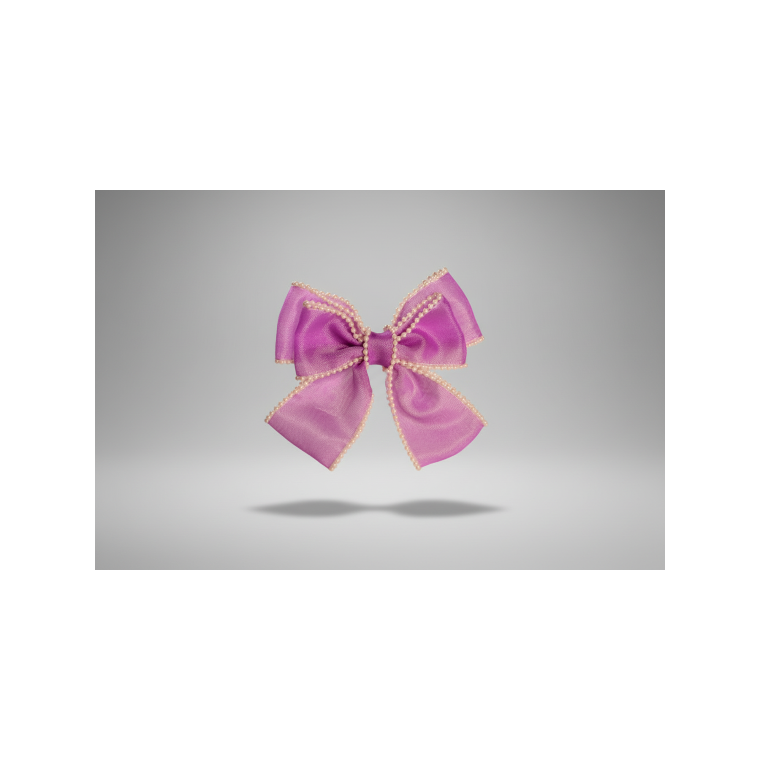 purple Handcrafted organza hair bow with delicate pearl trim on non-slip clip